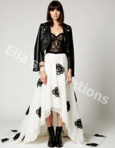 Wedding dress with black lace sleeves and neckline.